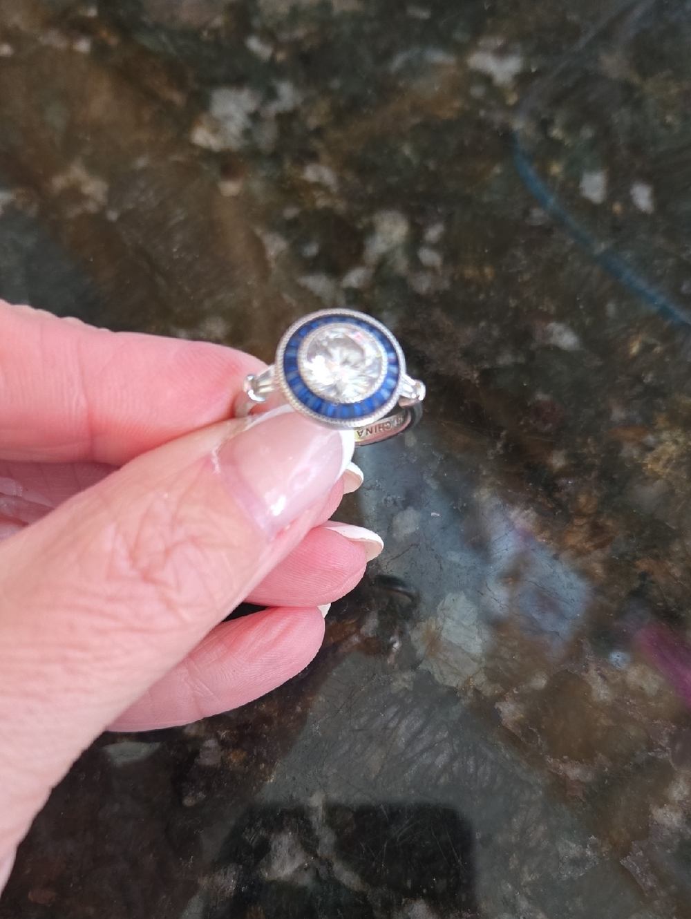 Sterling Silver Blue Halo Solitaire Ring with Clear Center Stone